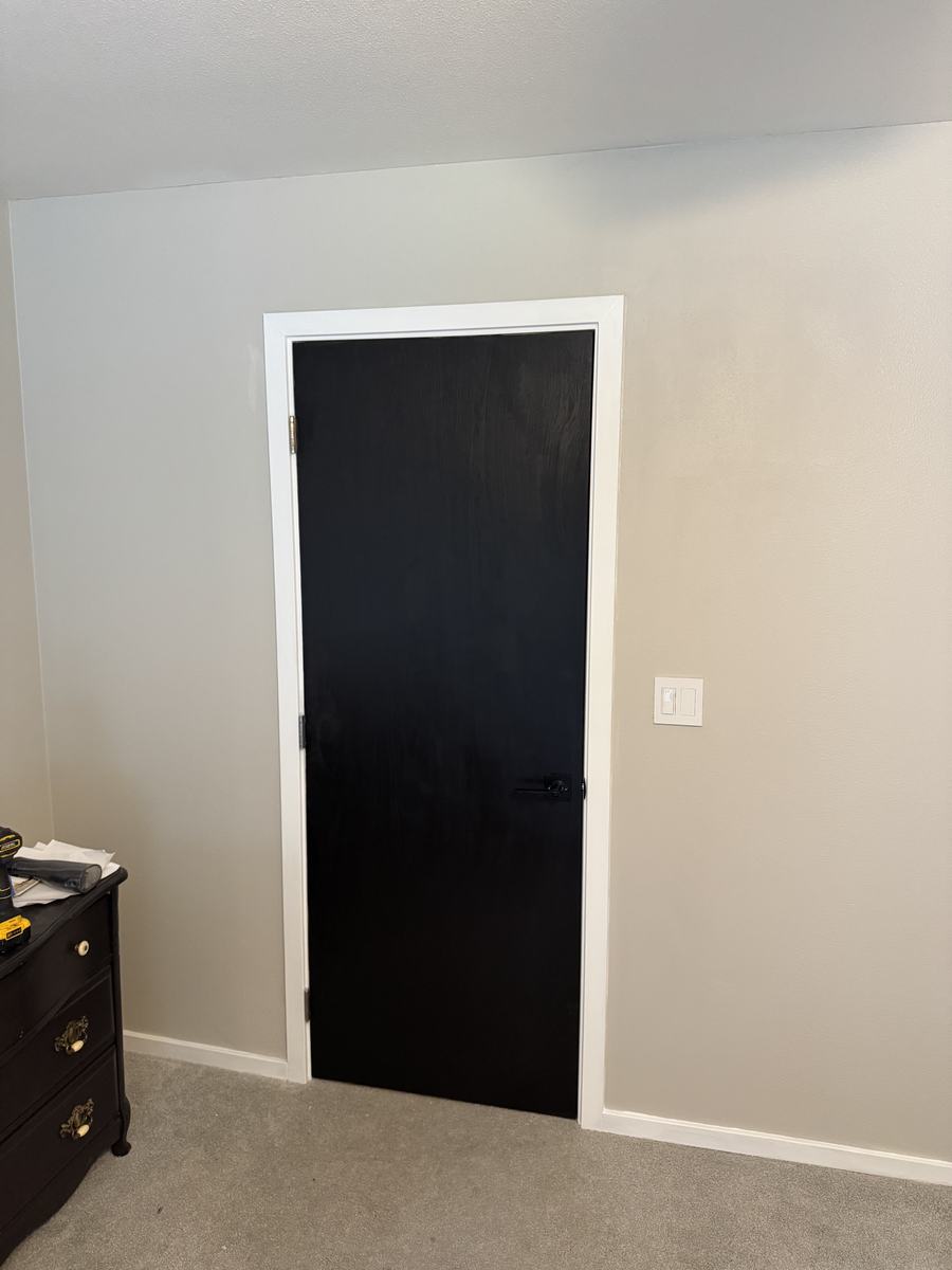 After — finished trim, painted door and wall, clean switch plate