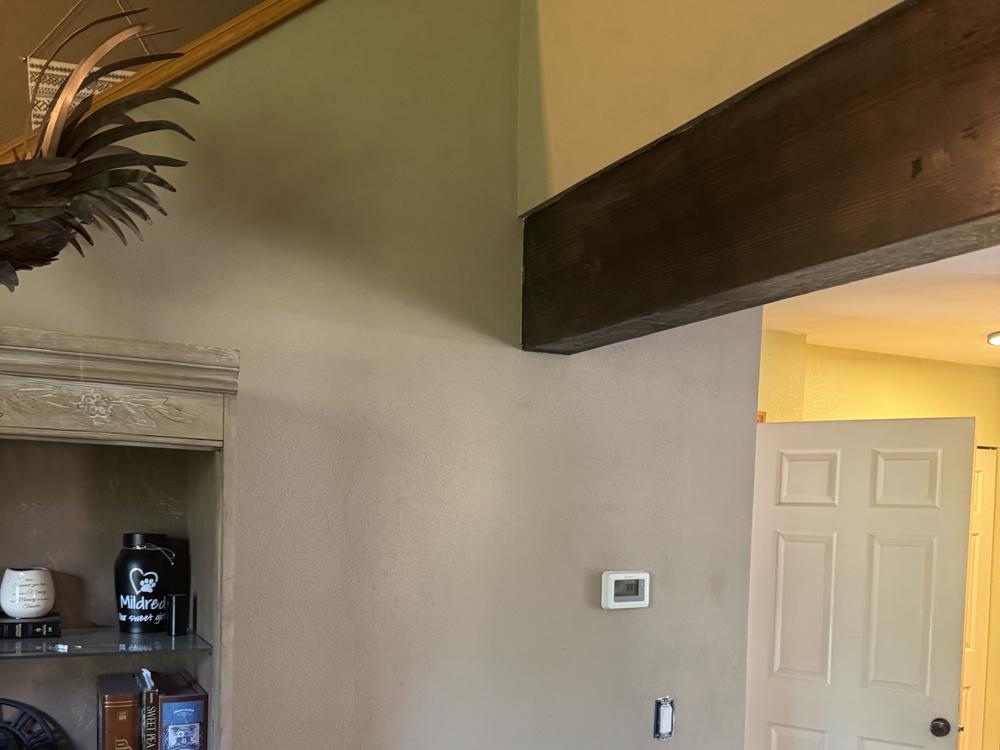 Completed wall and beam with smooth finished drywall